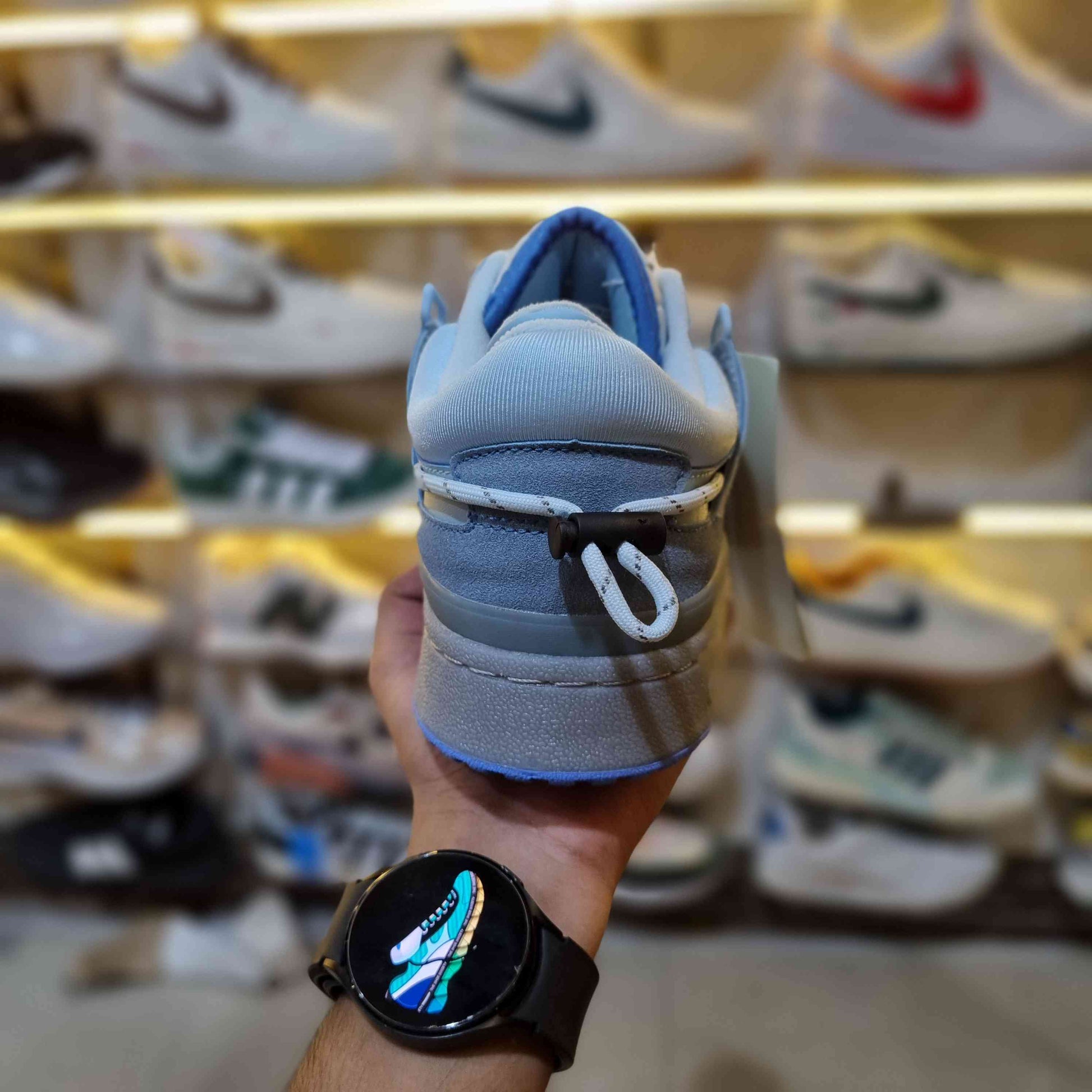 Close-up stitching of light-blue retro low-top sneakers with strap