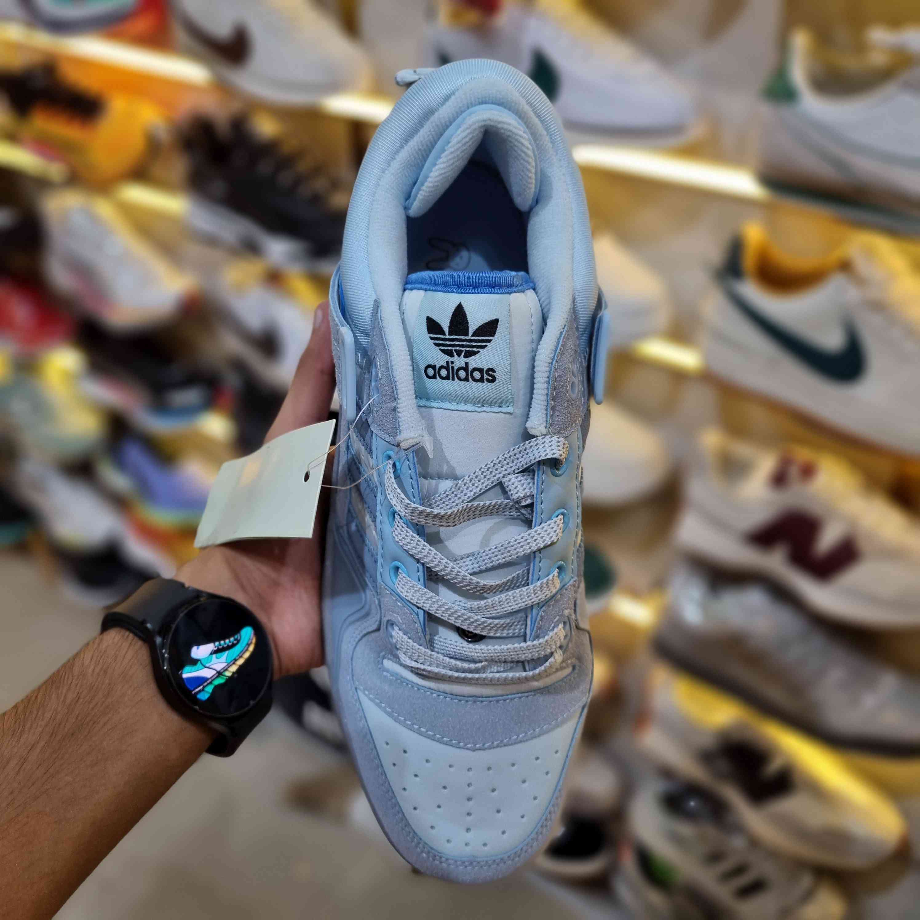 Lifestyle shot – light-blue retro low-top sneakers with strap for streetwear fashion