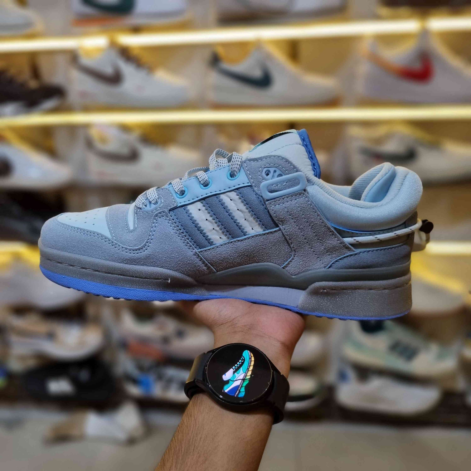 On-foot look – light-blue retro low-top streetwear sneakers with strap