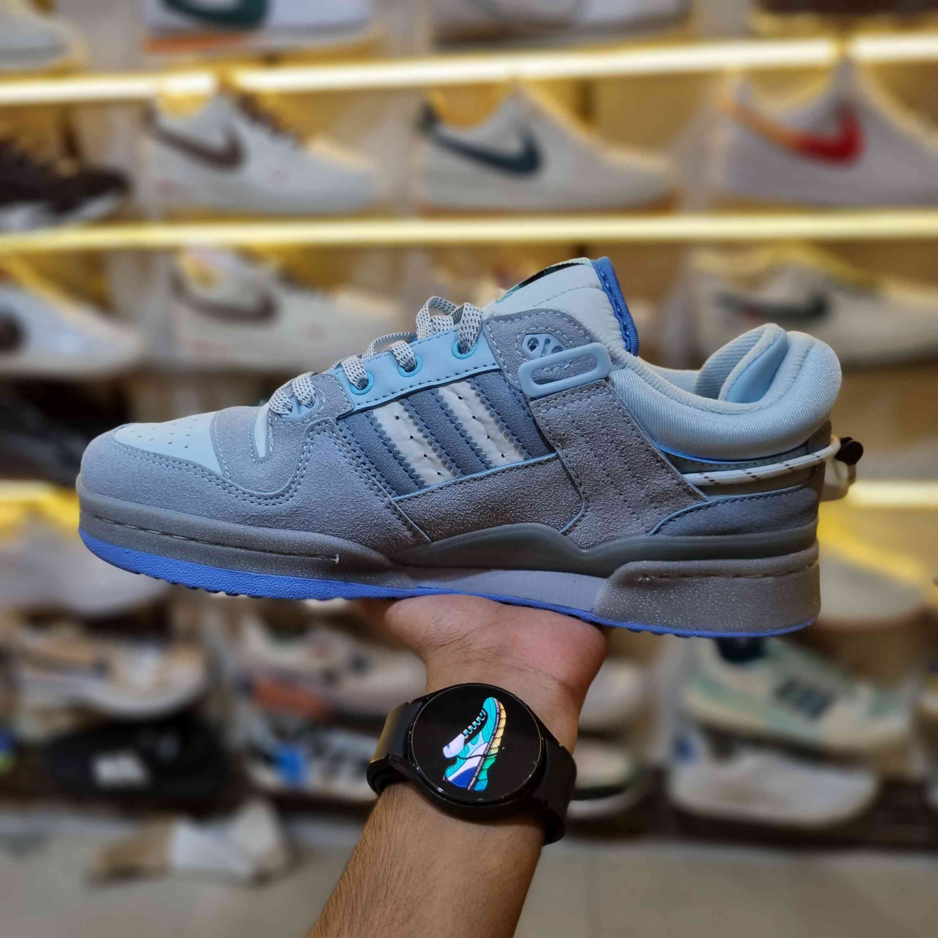 On-foot look – light-blue retro low-top streetwear sneakers with strap