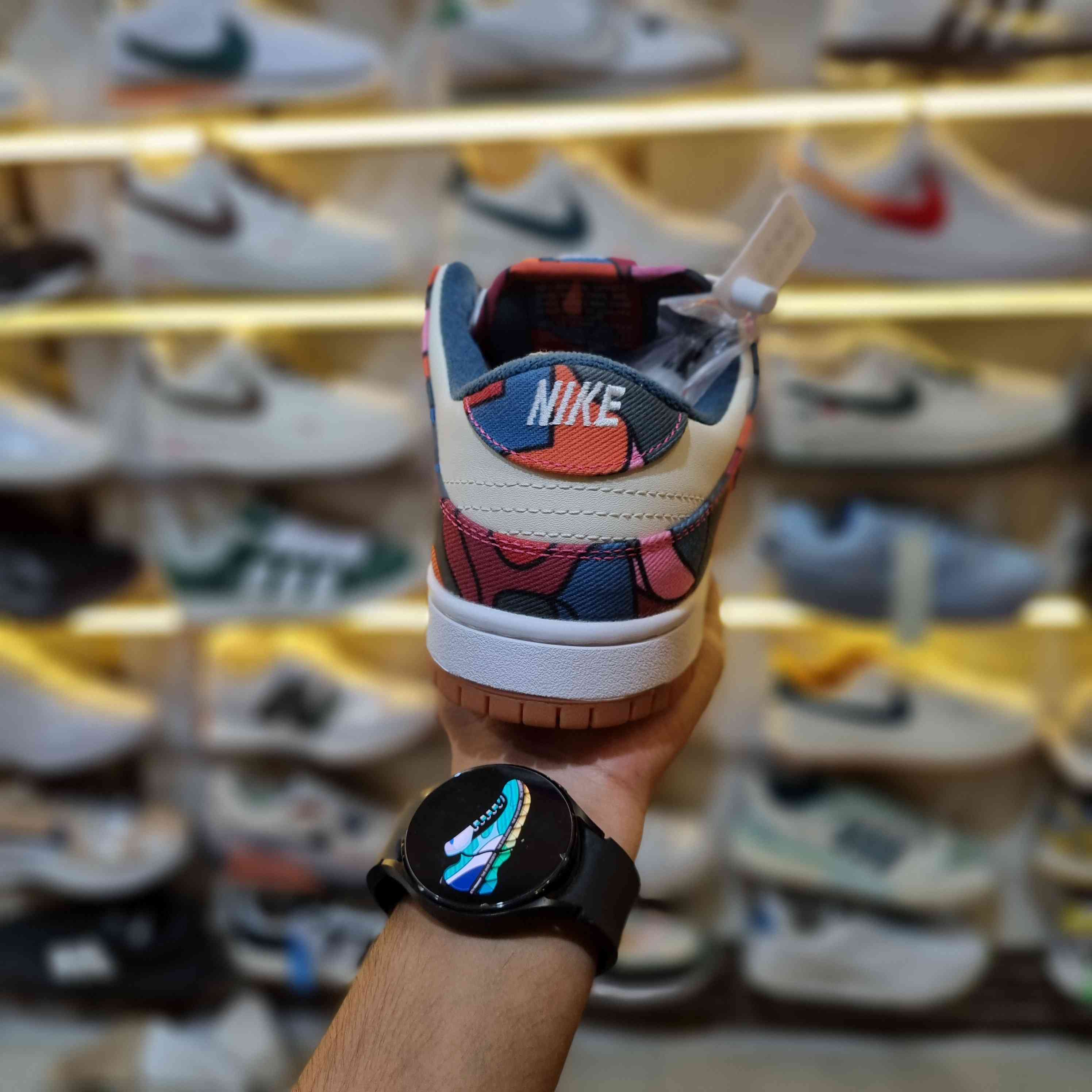 Close-up stitching of multicolor abstract art retro sneakers