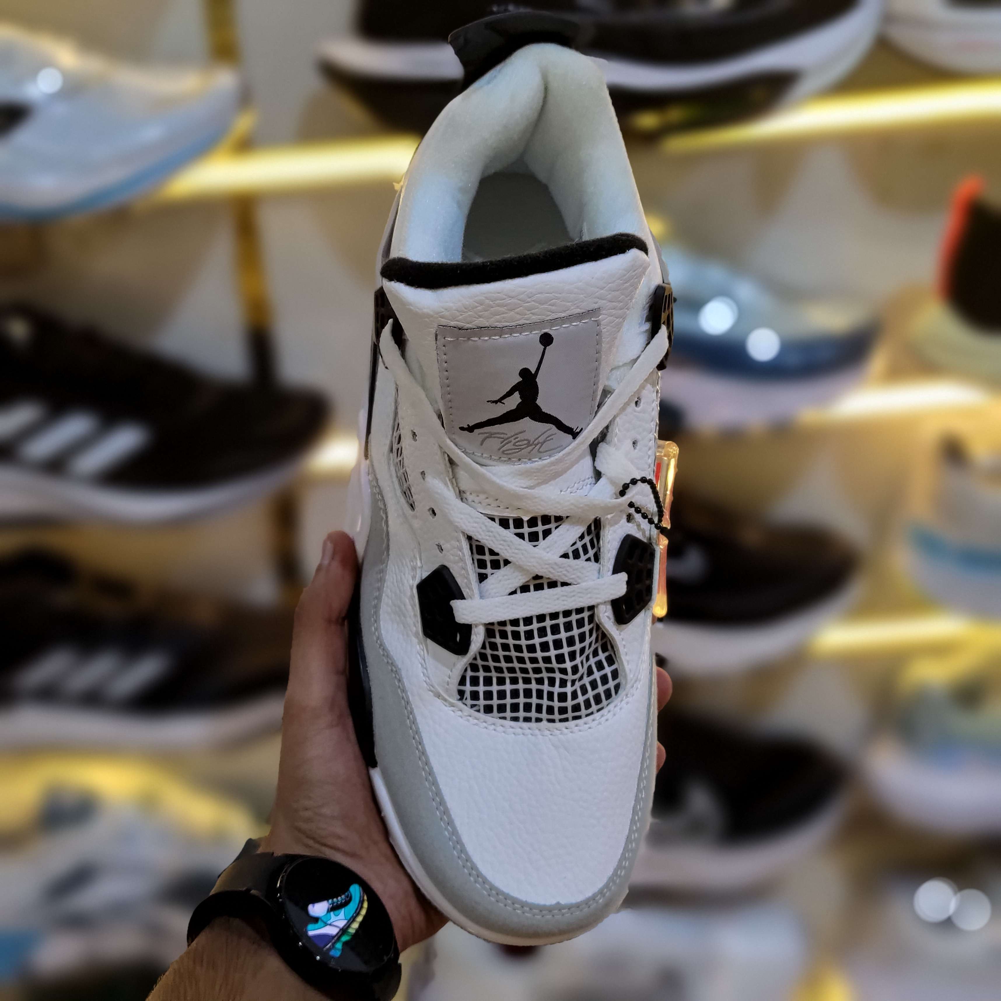 Jordan 4 Retro Military Black Premium Sneaker Side Profile - The Shoe Society